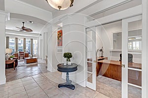 Foyer overlooking into home office and living room