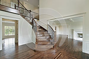 Foyer with wooden staircase photo