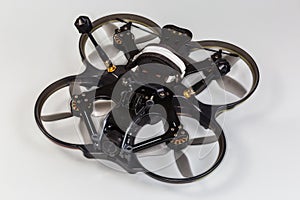 FPV drone with on-board camera on a gray background