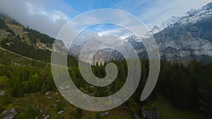 FPV maneuverable flight near the lake Oeschinensee in Swiss Alps, Switzerland.