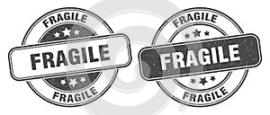 Fragile stamp. fragile label. round grunge sign