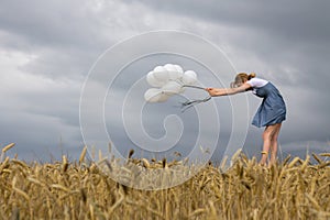 Fragile Woman Keeps Balloons Against Strong Wind