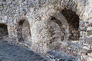 Fragment of ancient round stone . Castle in Stara Lubovna. Slovakia.