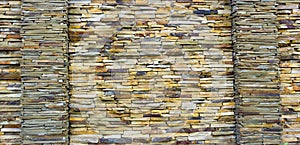 Fragment of artistic wall made with multiple stones