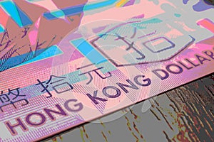 Fragment of a banknote of 10 Hong Kong dollars. Picture with pasteurization. Illustration on the theme of economics or banking.