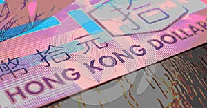 Fragment of a banknote of 10 ten Hong Kong dollars. Picture with pasteurization. Horizontal stories about economy or finance. Hong