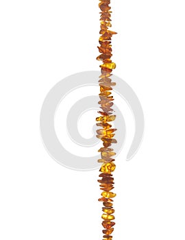 Fragment of beads from amber isolated on white background. A beautiful decoration for girls and women.