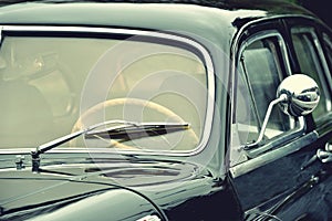 Fragment of beautiful stylish old car. Elegance. Prestige. Vintage style.