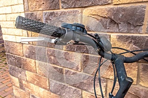 Fragment of a bicycle leaning against the wall.