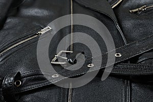 fragment of a black leather biker jacket