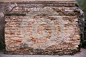 Fragment of brick pilaster with plaster