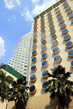 The fragment of a building with round windows.