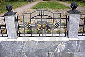 Fragment of cast-iron fence in baroque style .