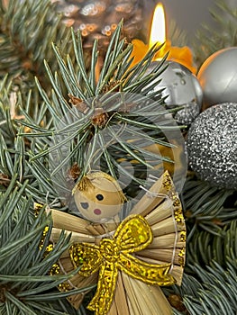 Fragment of a Christmas decoration with a candle and an angel