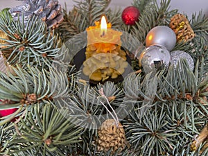 Fragment of a Christmas decoration with a candle and an angel