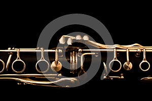 Fragment of clarinet on a black background