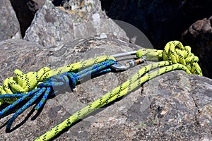 Fragment of climbing rope on rock