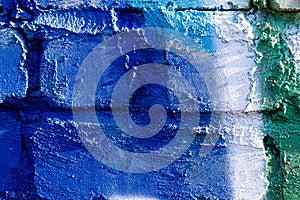 Fragment of colored graffiti painted on a brick wall. Abstract background for design