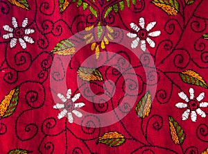 Fragment of colorful retro tapestry textile pattern with floral ornament useful as background