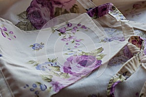 Fragment of colorful retro tapestry textile pattern with floral ornament useful as background. Floral textile or cloth