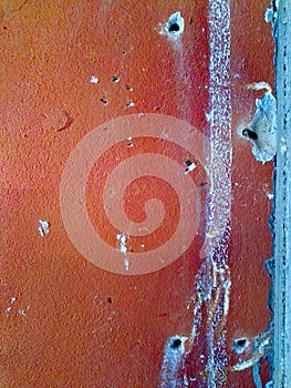 Fragment of concrete wall with hole from work or bullet.