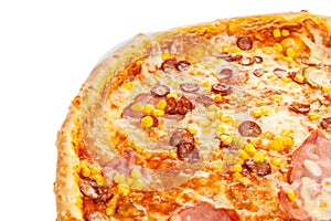 Fragment of delicious classic italian pizza with ham, sausages, corn, cucumbers and cheese