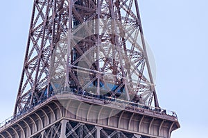 Fragment of the Eiffel tower on a bright sunny day. Paris