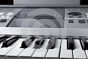 Fragment of electronic synthesizer keyboard with control buttons