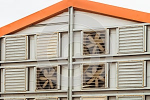 Fragment of the facade of an agricultural poultry house with a facade air exchange system