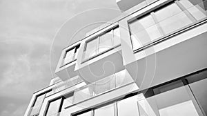 Fragment of a facade of a building with windows and balconies. Black and white.