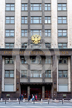 Fragment of the facade with the coat of arms of the State Duma of the Russian Federation