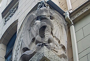 Fragment of the facade with the door of a residential building in the style of national romanticism
