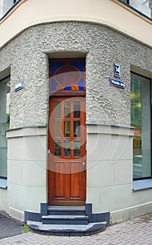 Fragment of the facade with the door of a residential building in the style of national romanticism