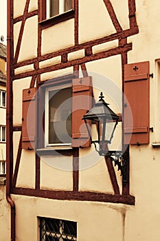 Fragment of facade of medieval house with lantern
