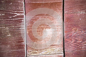 A fragment of a fence made of old brown polished boards and planks.Old wooden surface.Texture, background, close up