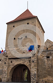 Fragment of the fortress wall with the entrance gates of Rupea Citadel built in the 14th century on the road between Sighisoara an