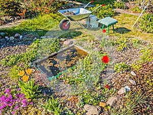 Fragment of the garden during spring cleaning works on a sunny day