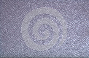 Fragment of genuine leather, pale purple color, high-quality processing with folds in the form of a fine mesh