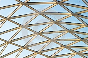 A fragment of a glass dome on the roof of the building. Geometric glass dome. Modern ceiling architecture