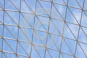 A fragment of a glass dome on the roof of the building. Geometric glass dome. Modern ceiling architecture