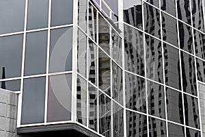 Fragment of glass and metal modern building. Business office exterior
