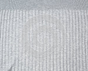 Fragment of gray knitted fabric, full frame, fabric for sweaters