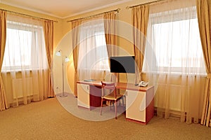 Fragment of an interior of the hotel room with a desk. Modern classics