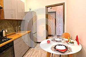 Fragment of the interior of a modern kitchen with a round table