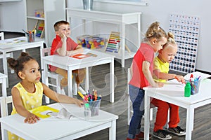 a fragment of a lesson in elementary school classroom. Students in the classroom are sitting at desks