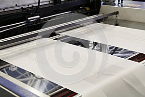 A fragment of a machine for the production of plastic bags