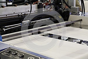 A fragment of a machine for the production of plastic bags