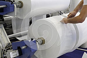 A fragment of a machine for the production of plastic bags