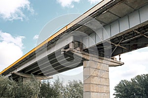 Fragment of metal train track bridge in the industrial area. bottom view