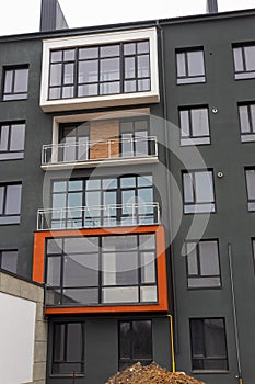 Fragment of Modern residential apartment with flat buildings exterior. Detail of New luxury house and home complex. Part
